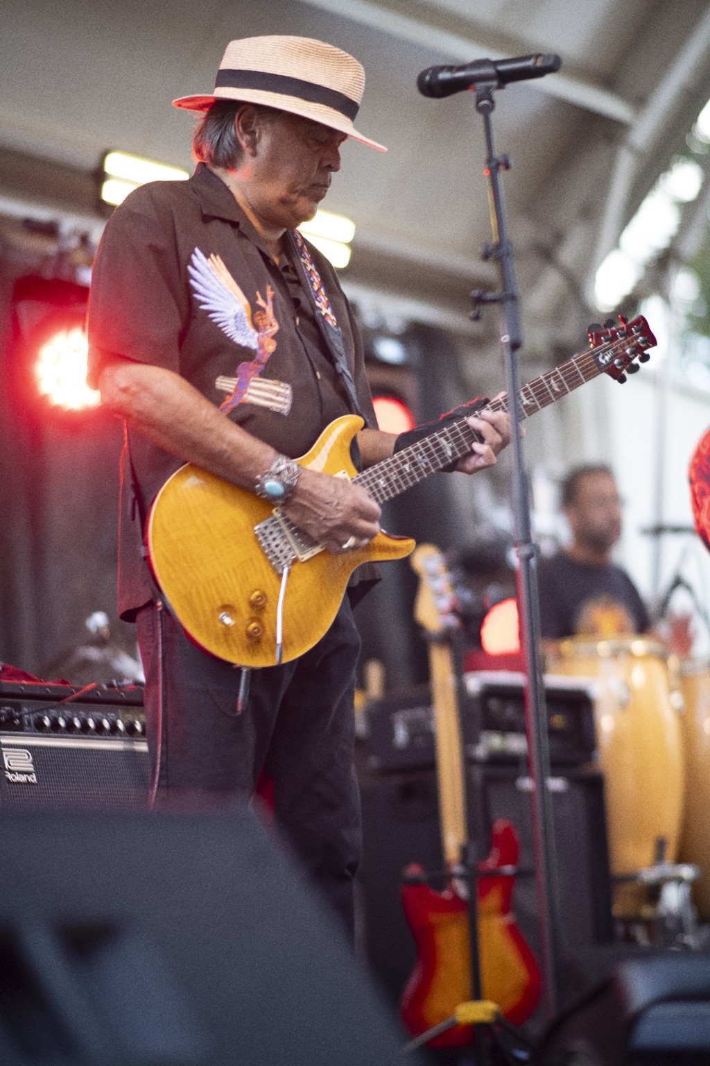 Guitarist performing on an outdoor stage