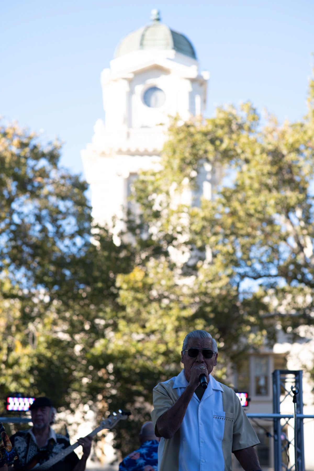 Ruben Ramos performing beneath the historic tower at Cesar E. Chavez Plaza during the 2026 Tejano Conjunto Festival in Sacramento